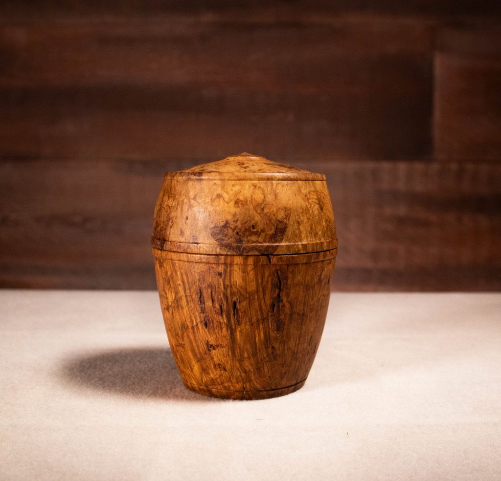 hand-carved wooden box with lid.